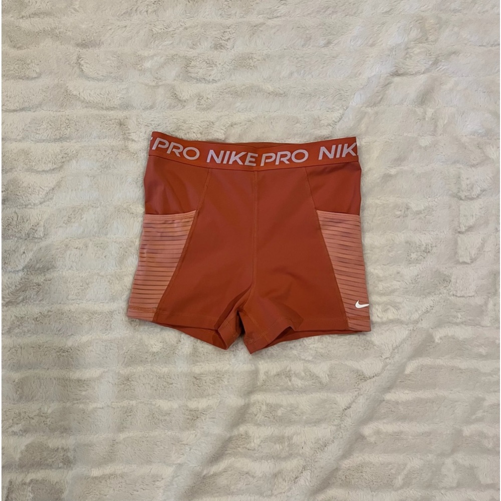 Nike, coral orange, size M